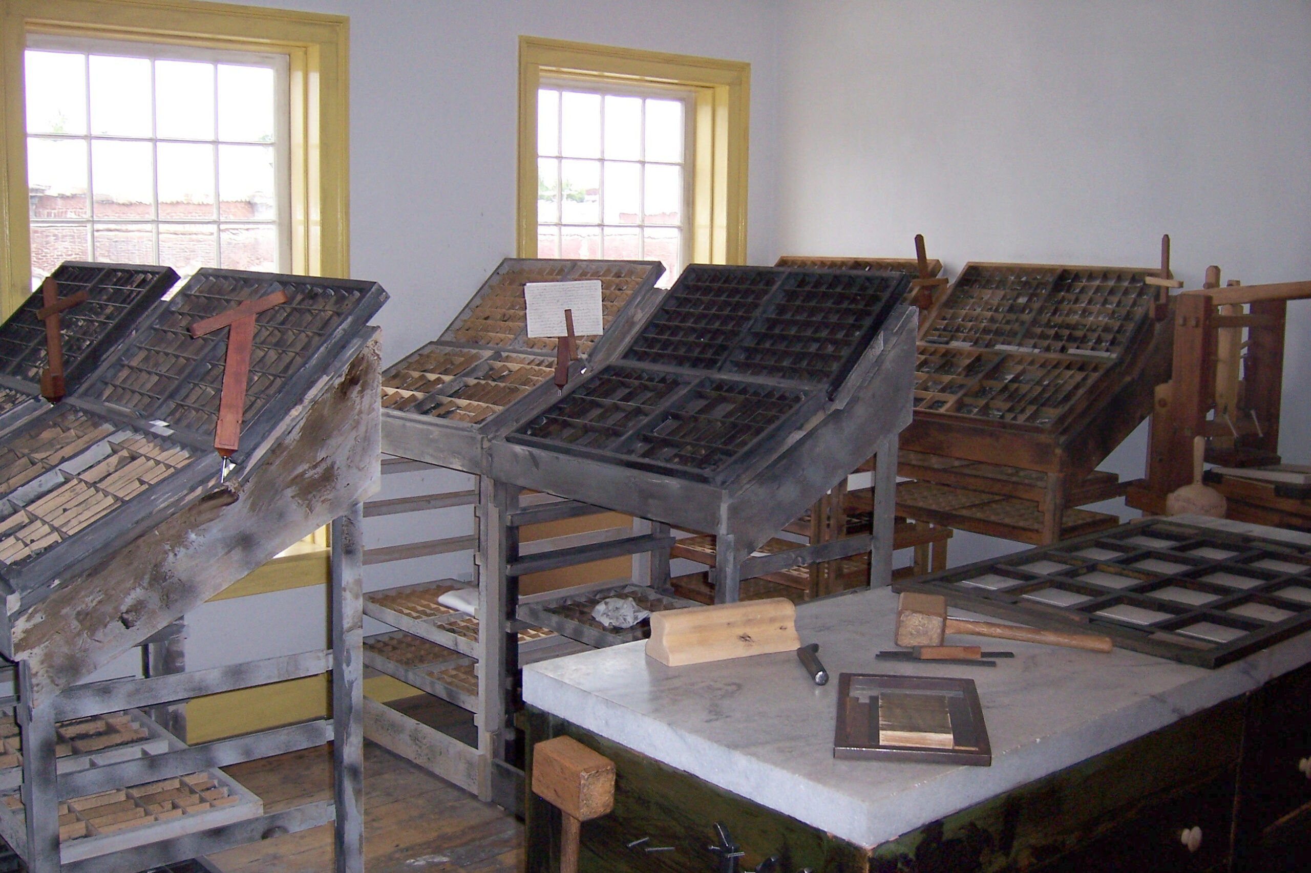 Movable type cases beside the windows in the restored third-floor Grandin print shop